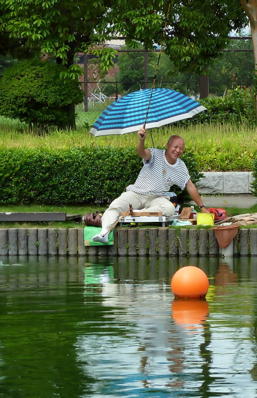 japanese man catches a fish