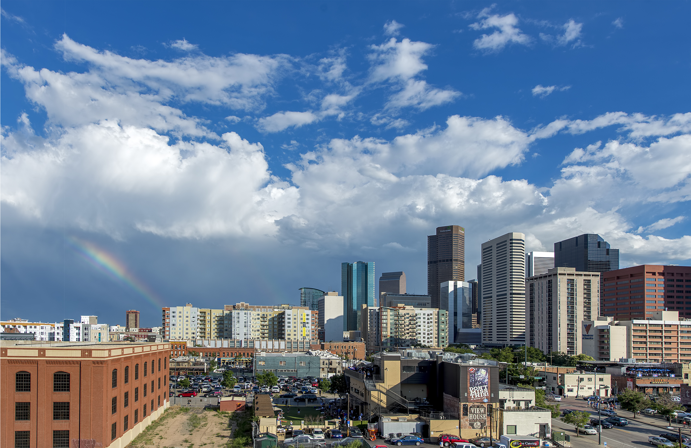 denver skyline from coors field with rainbow