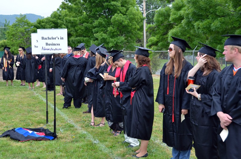 school of business students line up for graduation