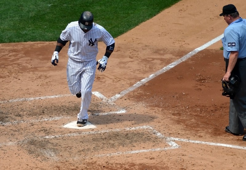 robinson cano of the yankees rounds the bases