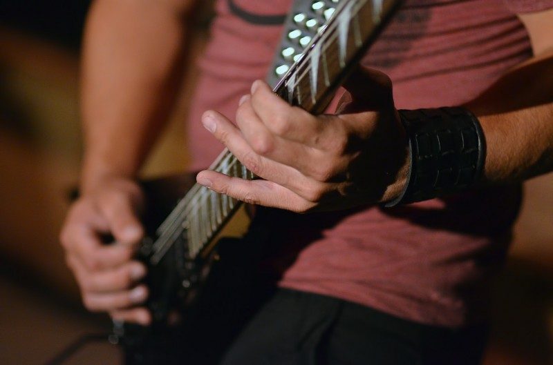 concert photography guitarist hands close up