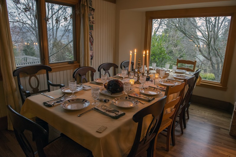 christmas dinner ham place settings candlelight