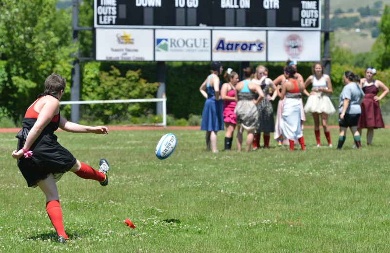 kick rugby ball in prom dress