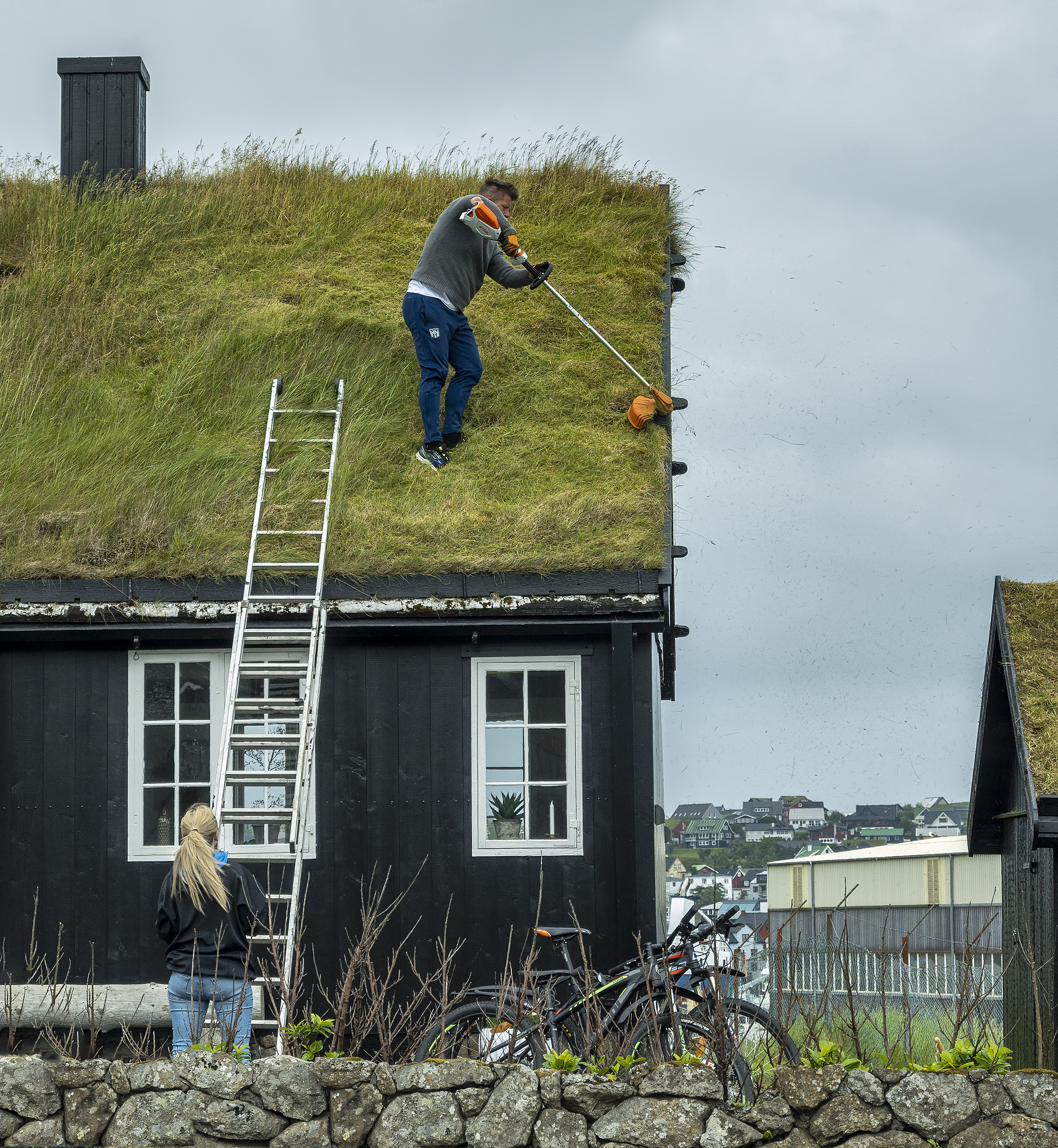 Turf Roof Dwellings faroe islands trimming roof grass